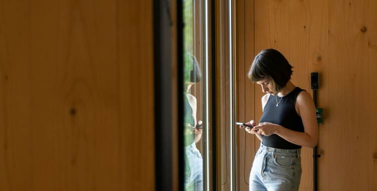 A person looking at her phone

AI-generated content may be incorrect.
