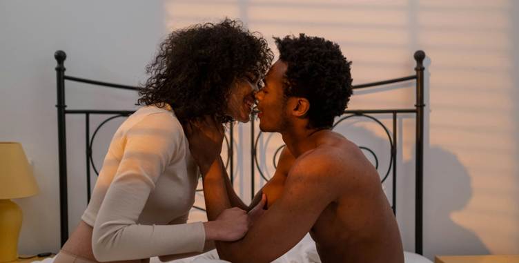 A person and person kissing on a bed

AI-generated content may be incorrect.