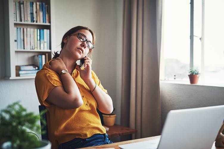 Stressed woman using phone