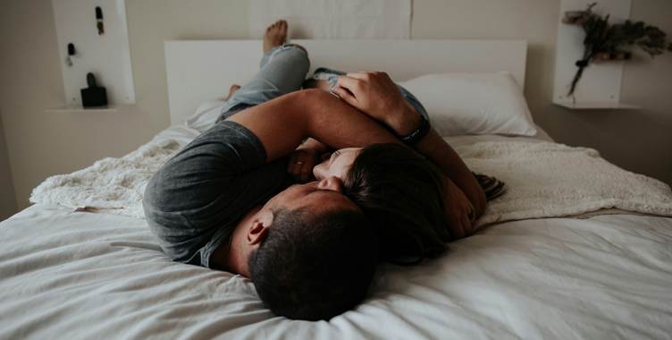 A person and a person lying on a bed, AI-generated content can be wrong.